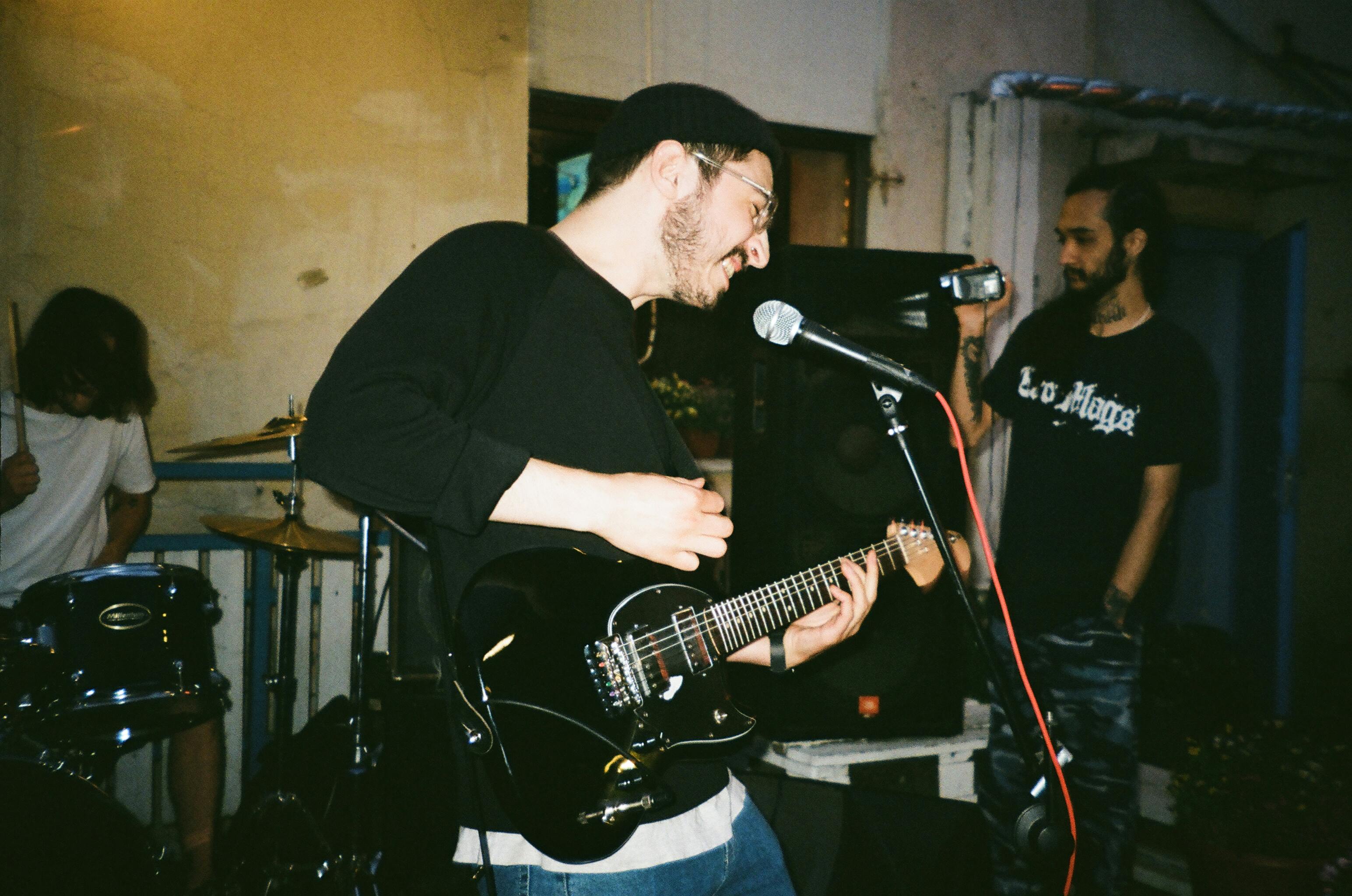 Close-up of a person's hands on a MIDI controller.